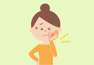歯が痛い女性